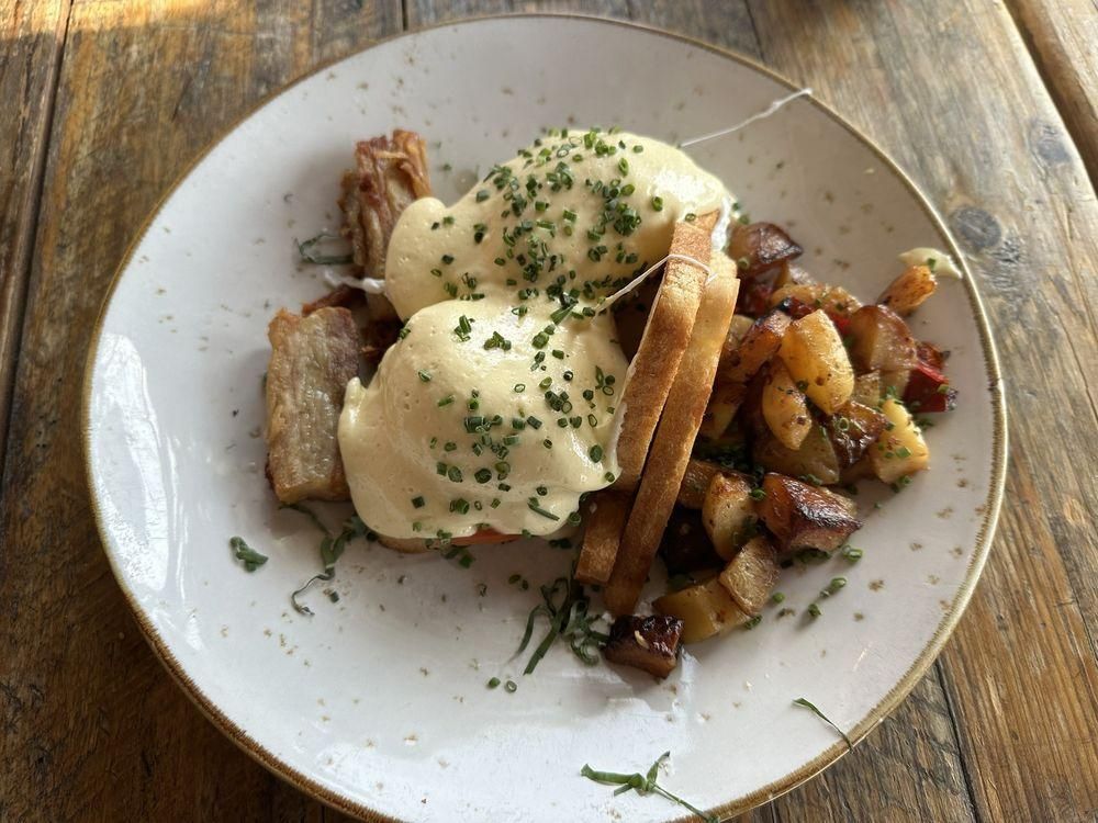 Pork Belly Eggs Benedict dish